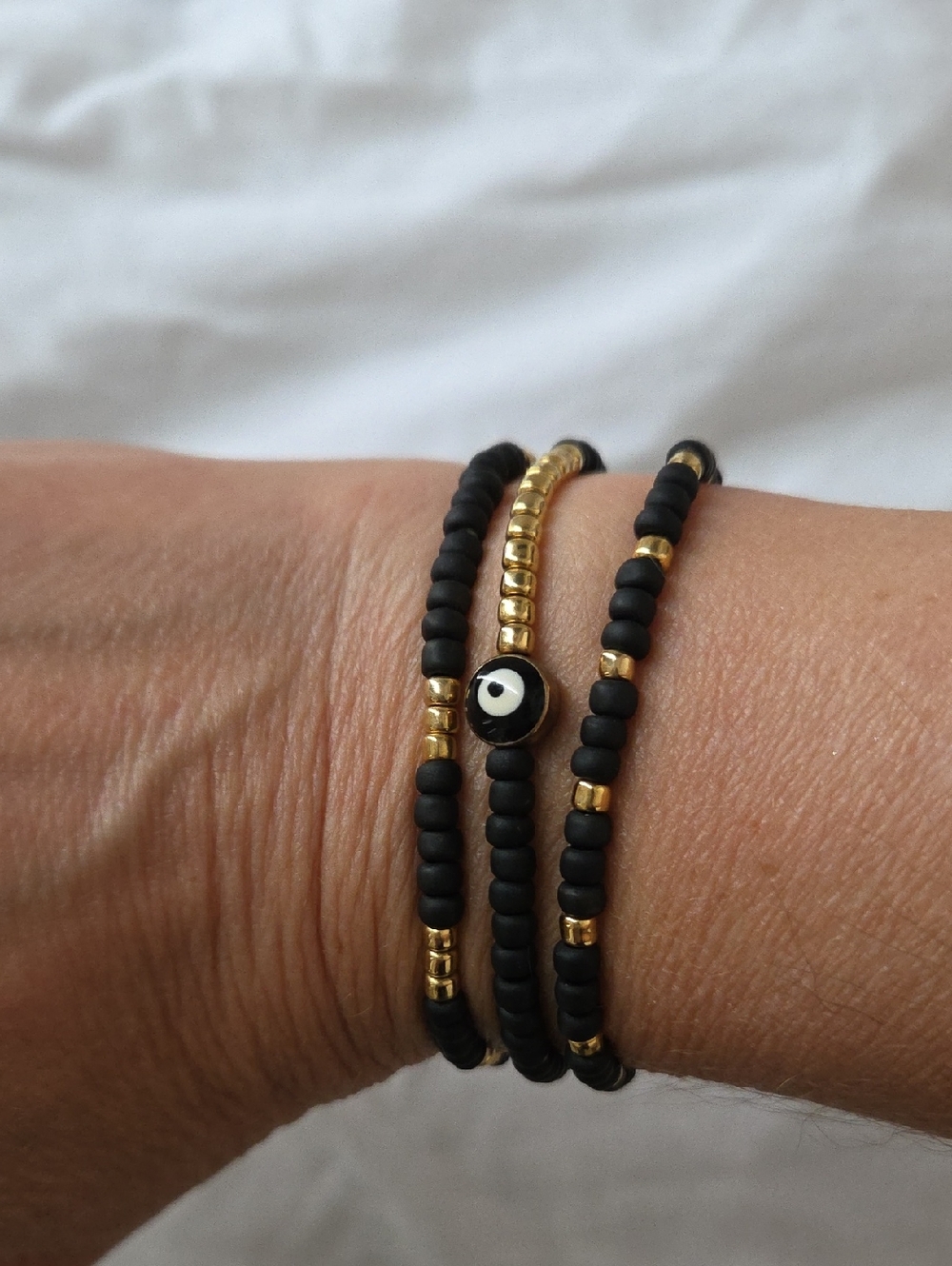 Black and Gold Beaded Bracelets - 3 Stack with Evil Eye Accent